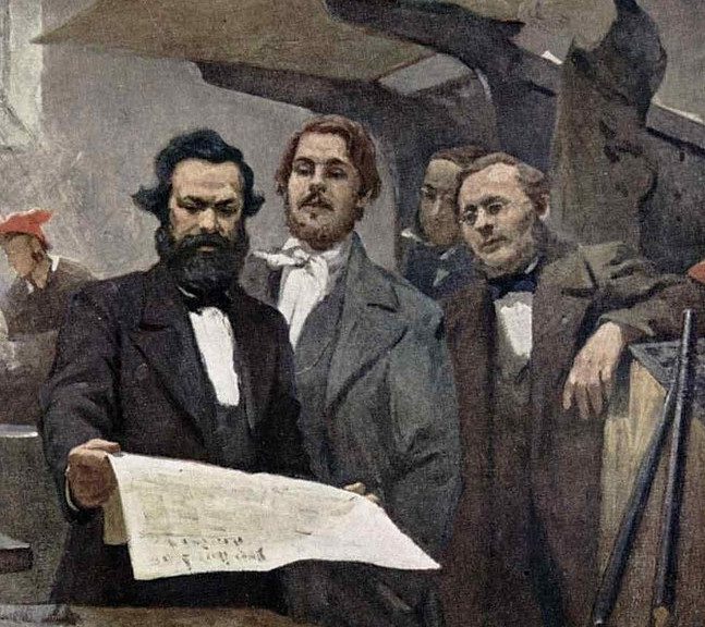 Marx (holding newspaper) and Engels (next to him) at work for the Neue Rheinische Zeitung, anonymous oil painting, 1849.